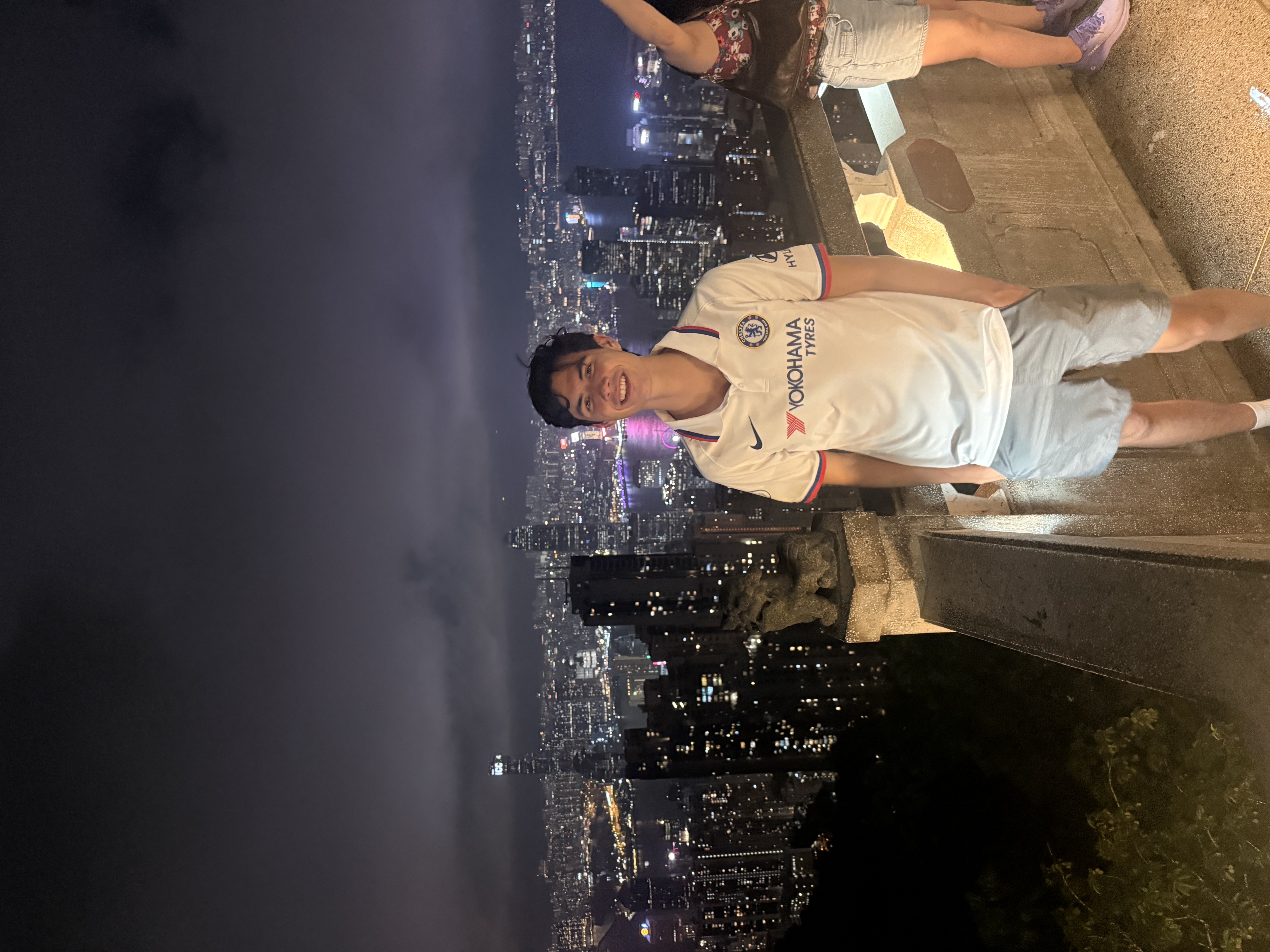 Spencer at Victoria Peak overlooking Hong Kong at night